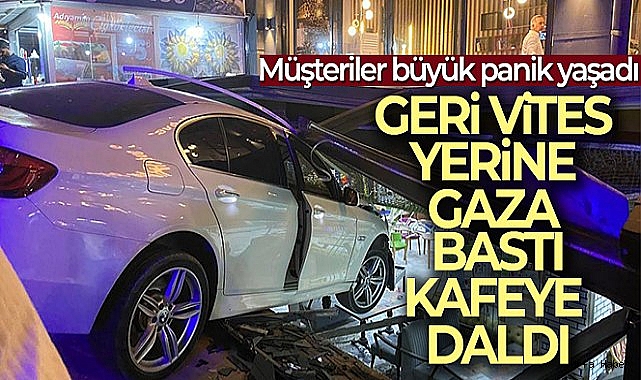 Geri vites yerine gaza bastı, otomobil kafeye daldı